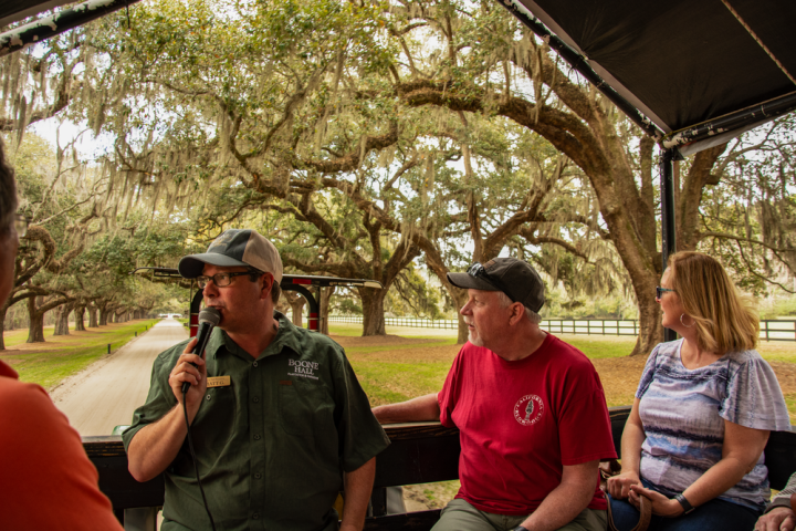 a group of people sitting at a park