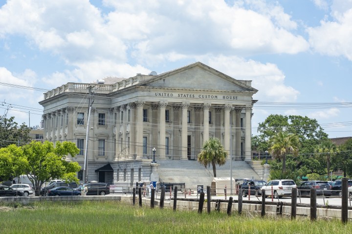a group of people in front of a building